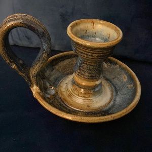 Vintage hand wheeled pottery candle holder. I’m shades of blue and tan.